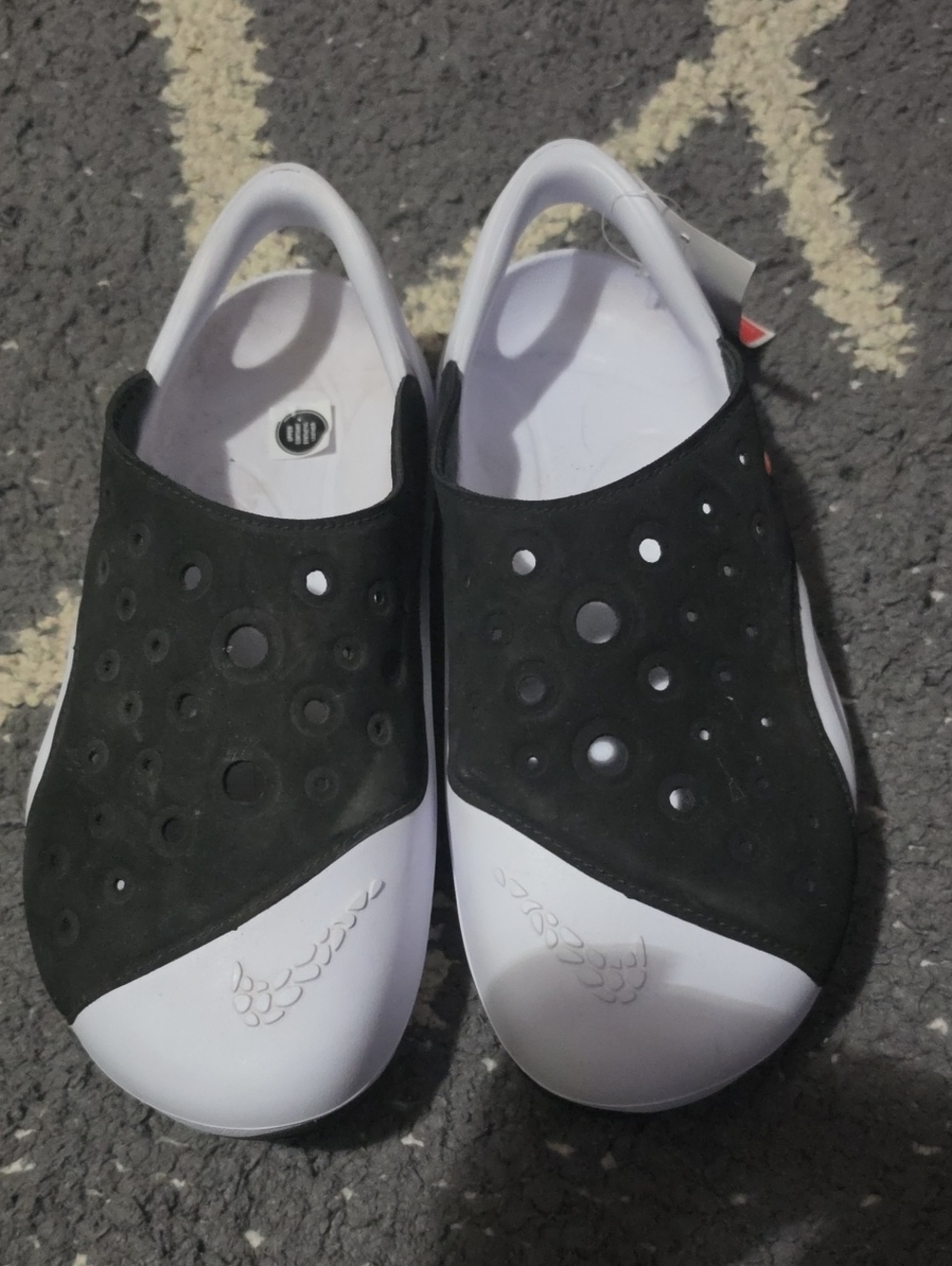 Nike Kids Black and White Slip-On Sandals with Perforated Upper